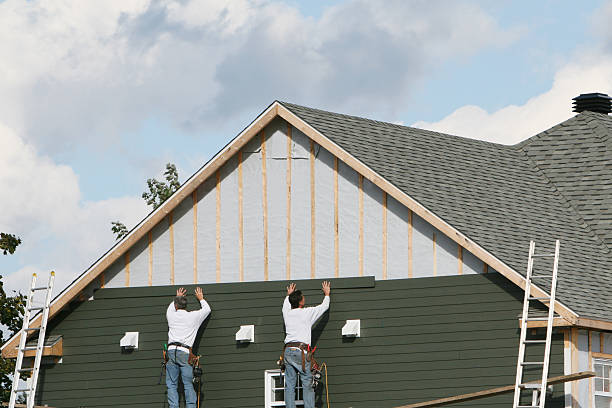 Professional Storm Damage Siding Repair technician working in Saxton, PA